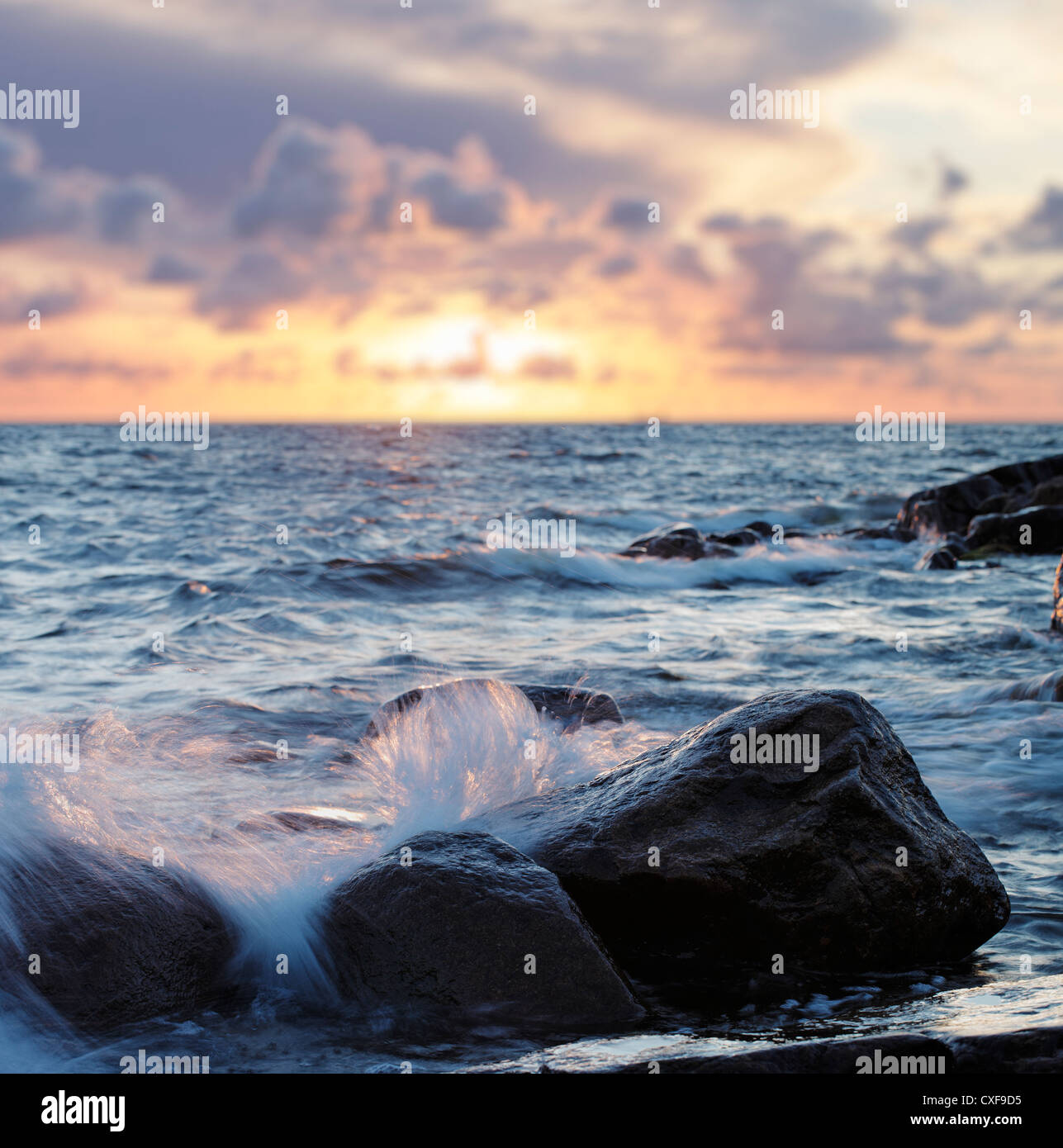 Sea waves splashing on rocks Stock Photo - Alamy