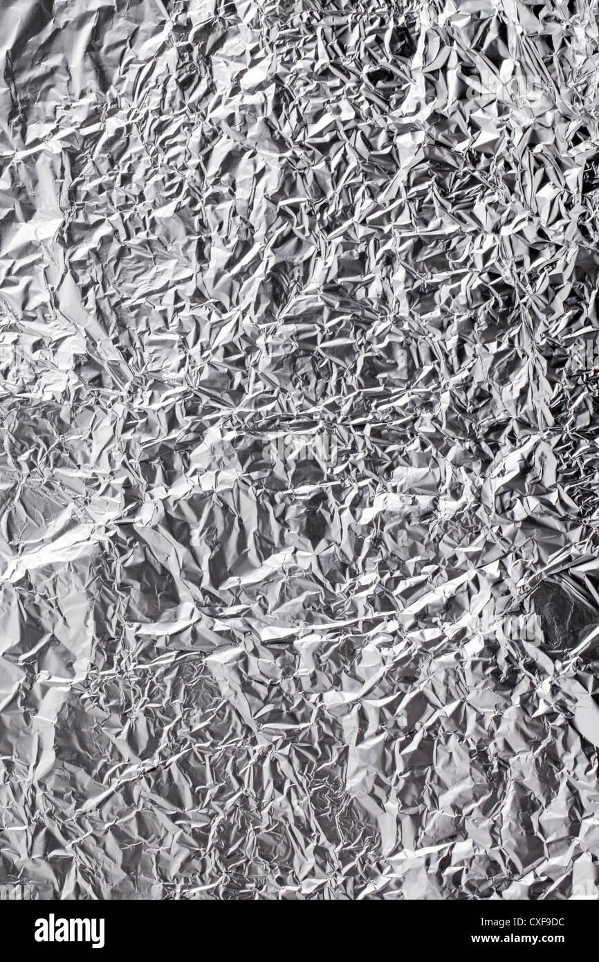 Background texture of wrinkled aluminium foil. Stock Photo