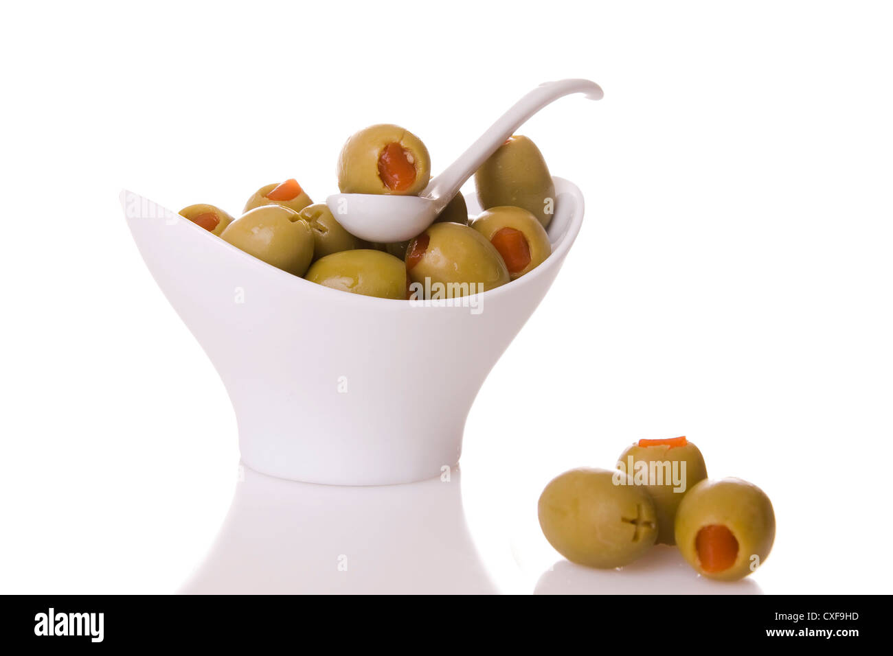 Green olives isolated on a white background Stock Photo - Alamy