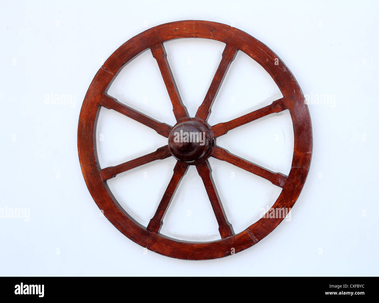wooden wheel on wall Stock Photo