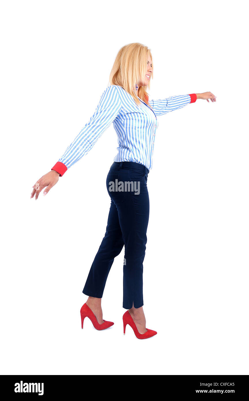 Isolated young business woman walking rope Stock Photo - Alamy