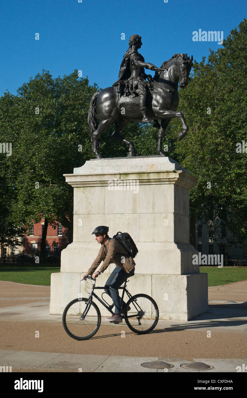 Cyclist passing William III statue Queen Square Bristol Stock Photo Alamy