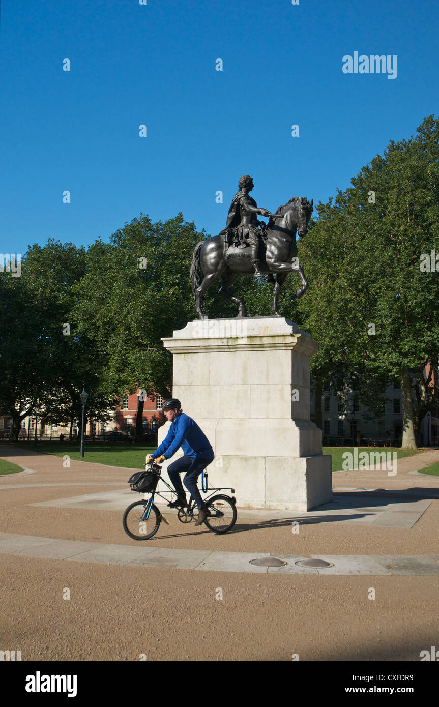 Cyclist passing William III statue Queen Square Bristol Stock Photo Alamy