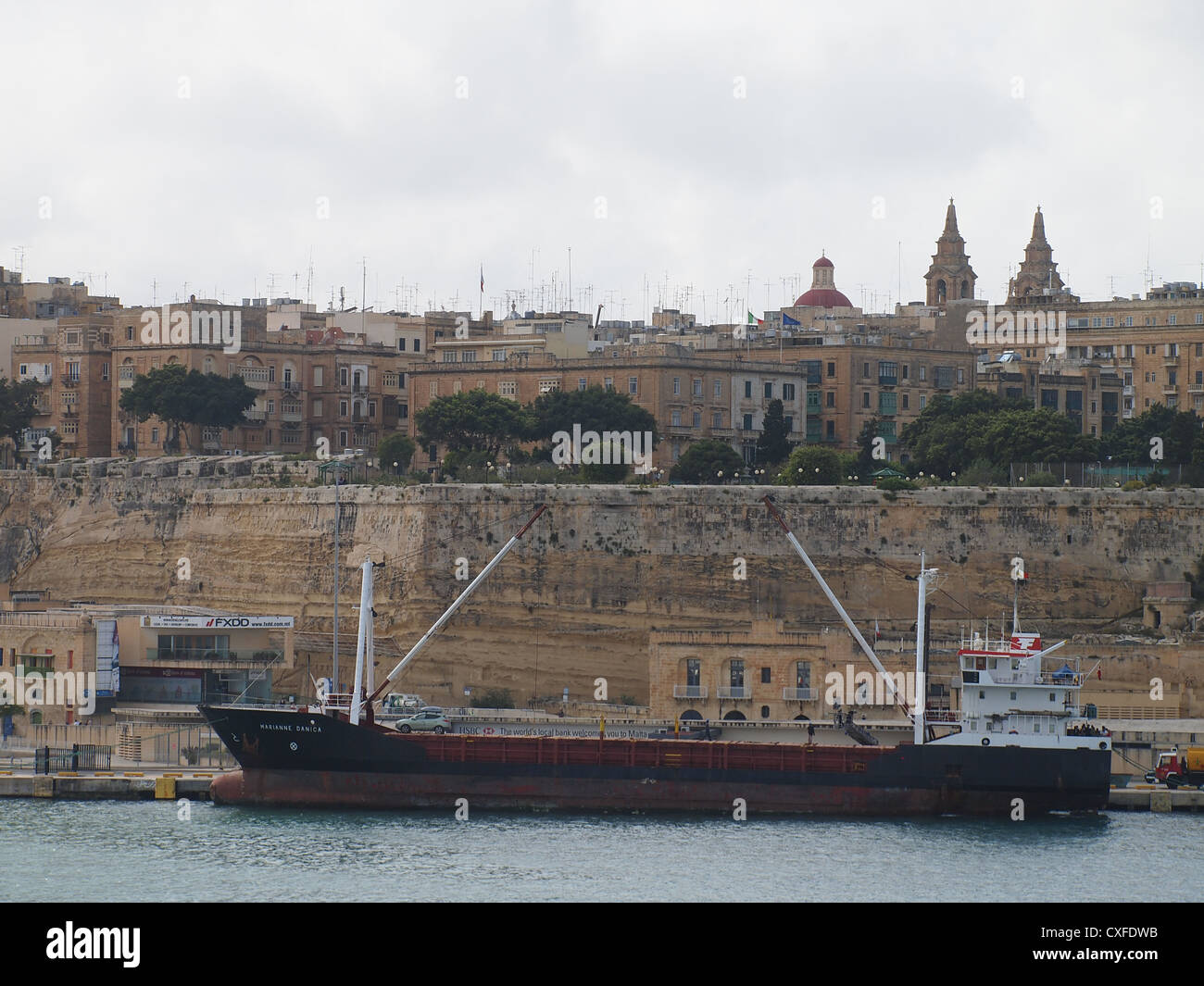 A freighter in a port Valletta on Malta island Stock Photo - Alamy