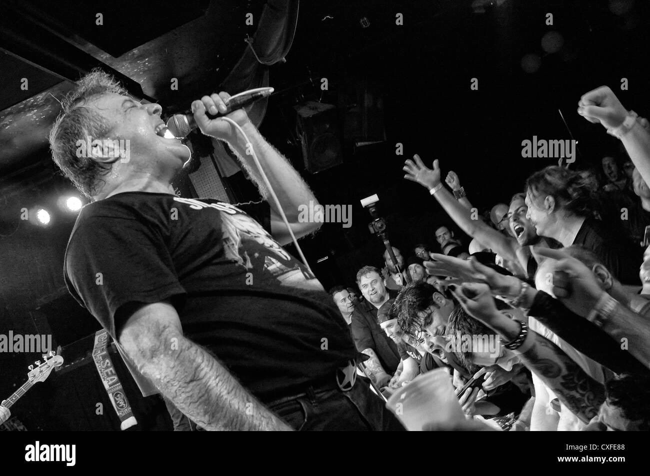 black and white photo of a Jello Biafra and the Guantanamo School of Medicine concert in the Knitting Factory in New York City Stock Photo