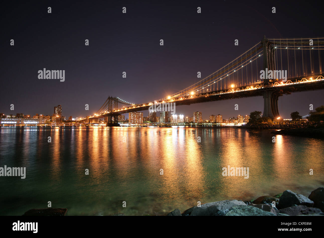 New York skyline at night from the East River Stock Photo