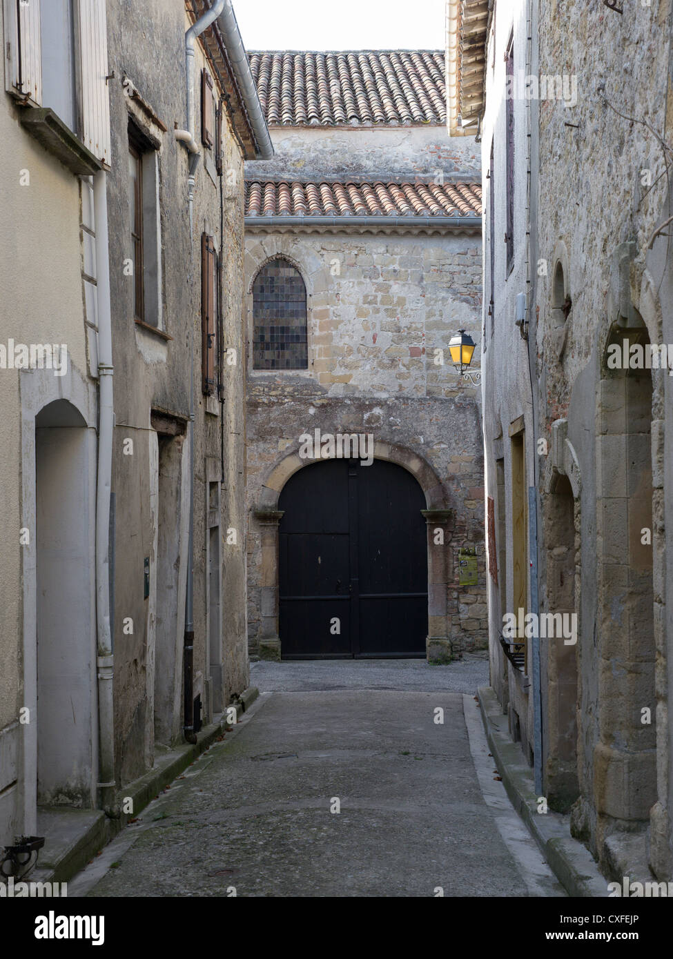 An ancient stone doorway in the medieval old town streets of Fanjeaux in Aude, Languedoc, France Stock Photo