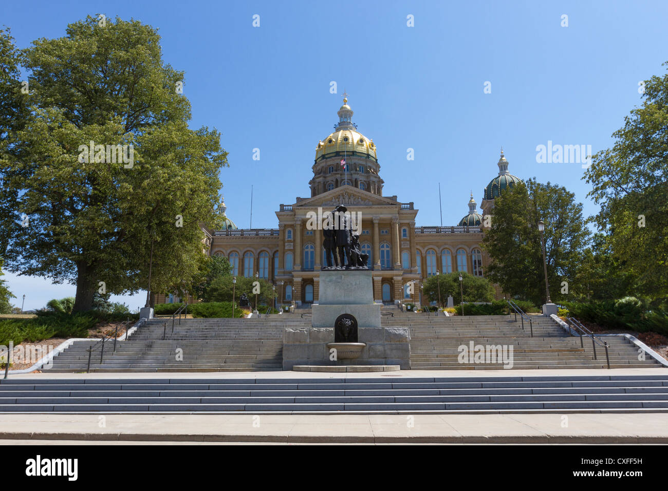 Steps leading to Iowa state capitol building or statehouse with Pioneers of the Territory statue in Des Moines Stock Photo