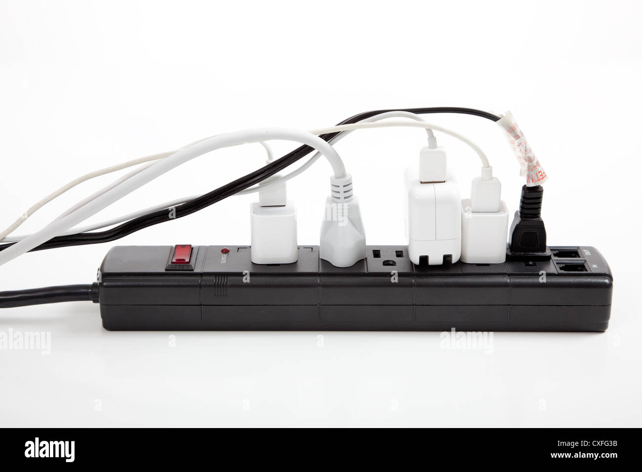 Surge protector full of plugs Stock Photo - Alamy