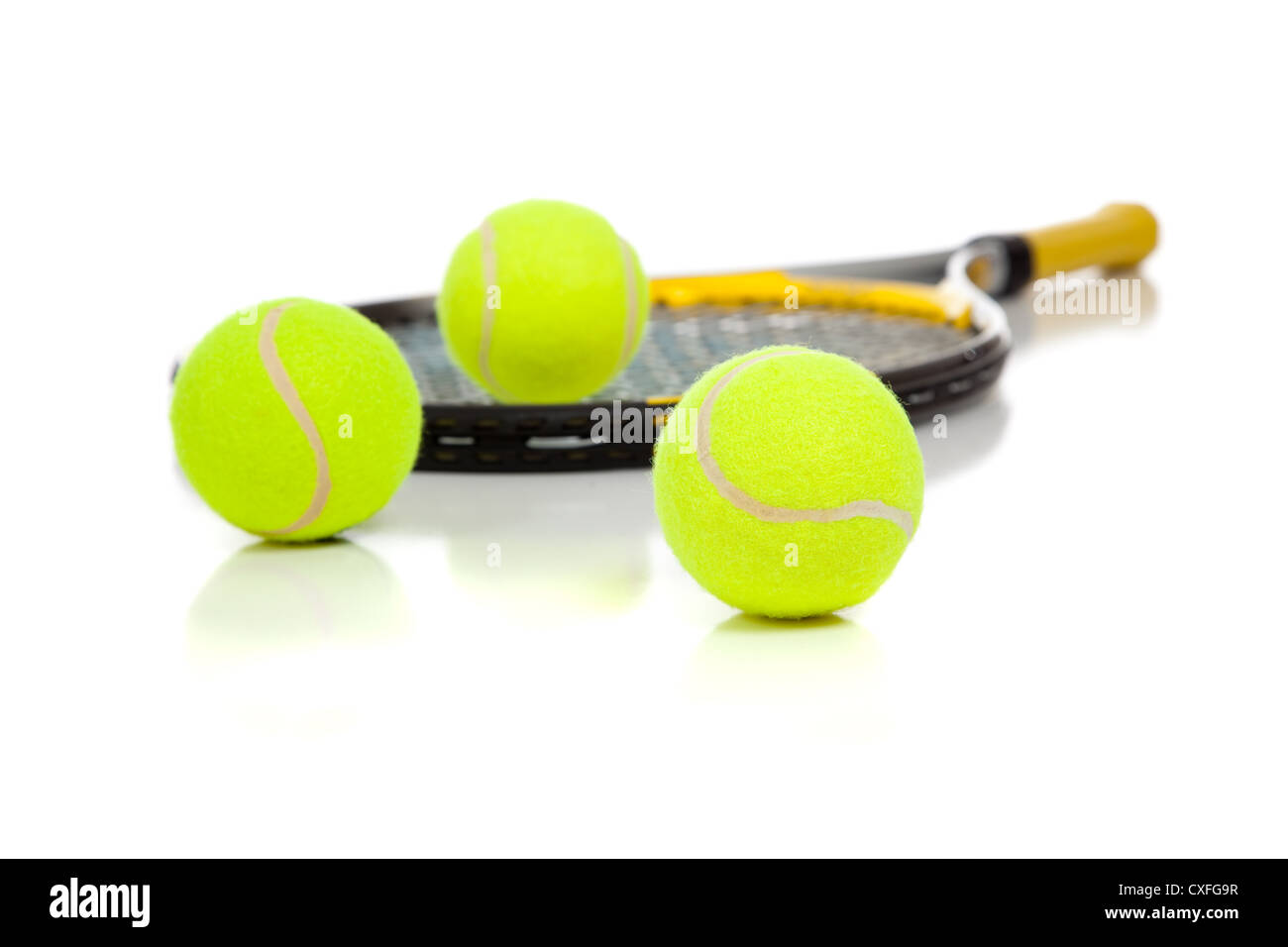 tennis racket with green tennis balls Stock Photo