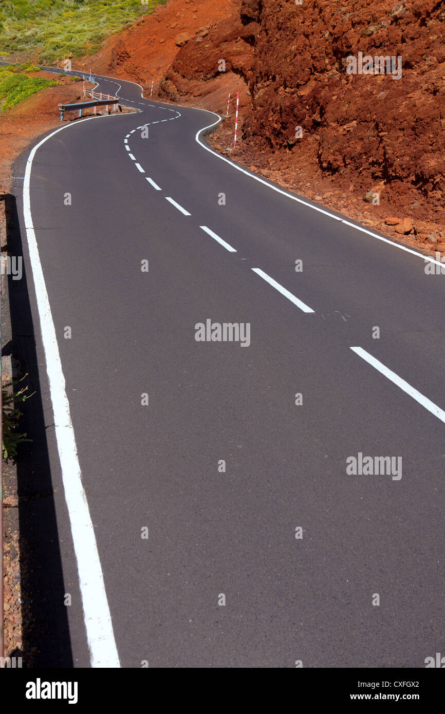 Canary Islands winding road curves in red mountain Stock Photo