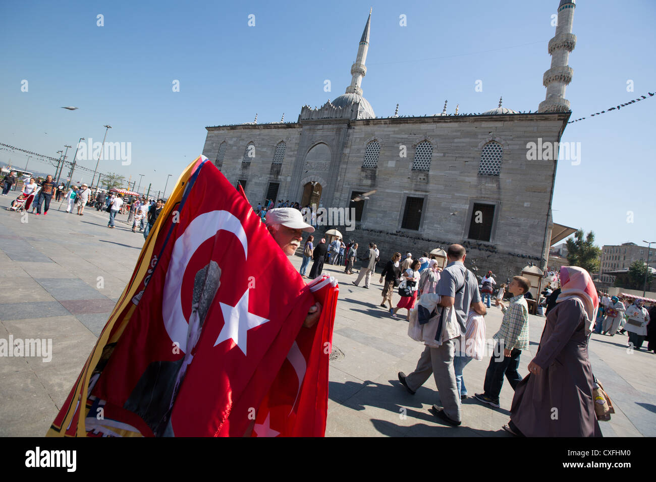 Flag seller outside the Yeni Mosque, in Istanbul, in Turkey Stock Photo