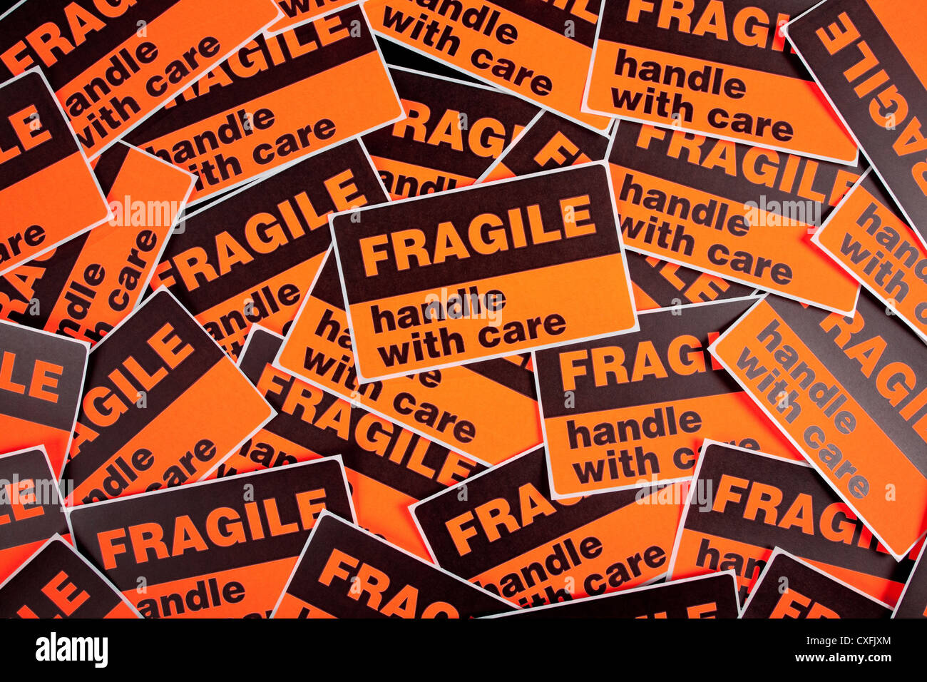 Background made of orange 'fragile' stickers Stock Photo