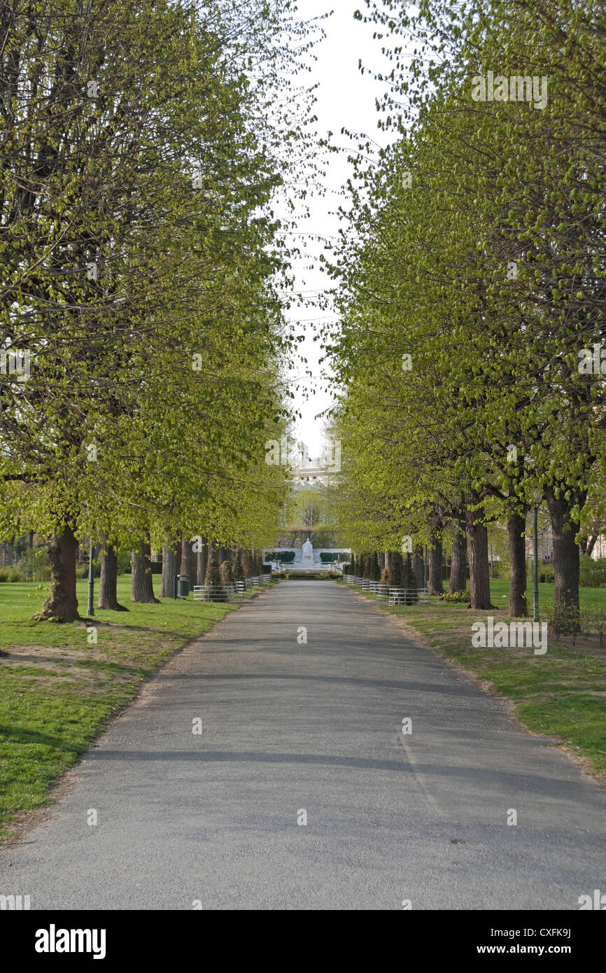 General view down a tree lined path in the Volksgarten, Vienna, Austria. Stock Photo