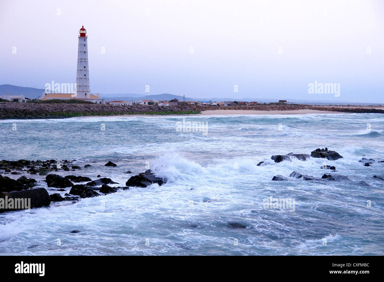 Lighthouse in 'Farol' island at sunrise, Ria Formosa, natural conservation region in Algarve, Portugal Stock Photo