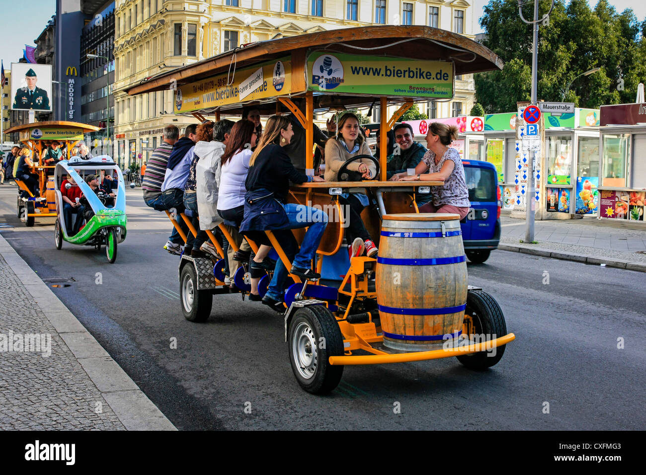 Young people having fun on the Berlin Beer Bike Booze Cruise Stock Photo