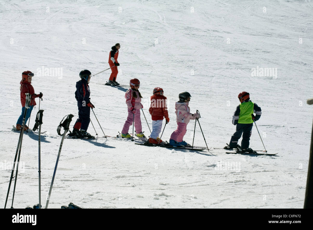 Children learning to ski at ski school on the pistes at Alpe Di Siusi Seiser Alm Val Gardena  Dolomites Italy Stock Photo