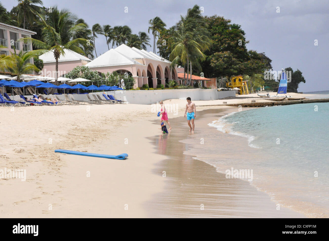Tropical beach Royal Pavilion Barbados, bright sun and sea,f amily Stock Photo
