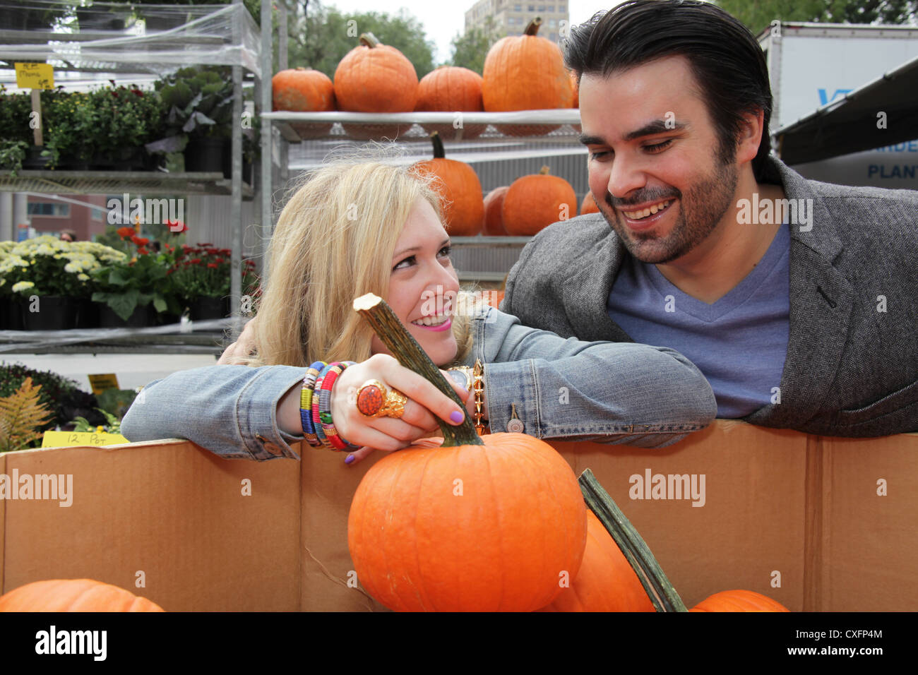 Couple choosing pumpkins at the Union Square Farmer's Market in New