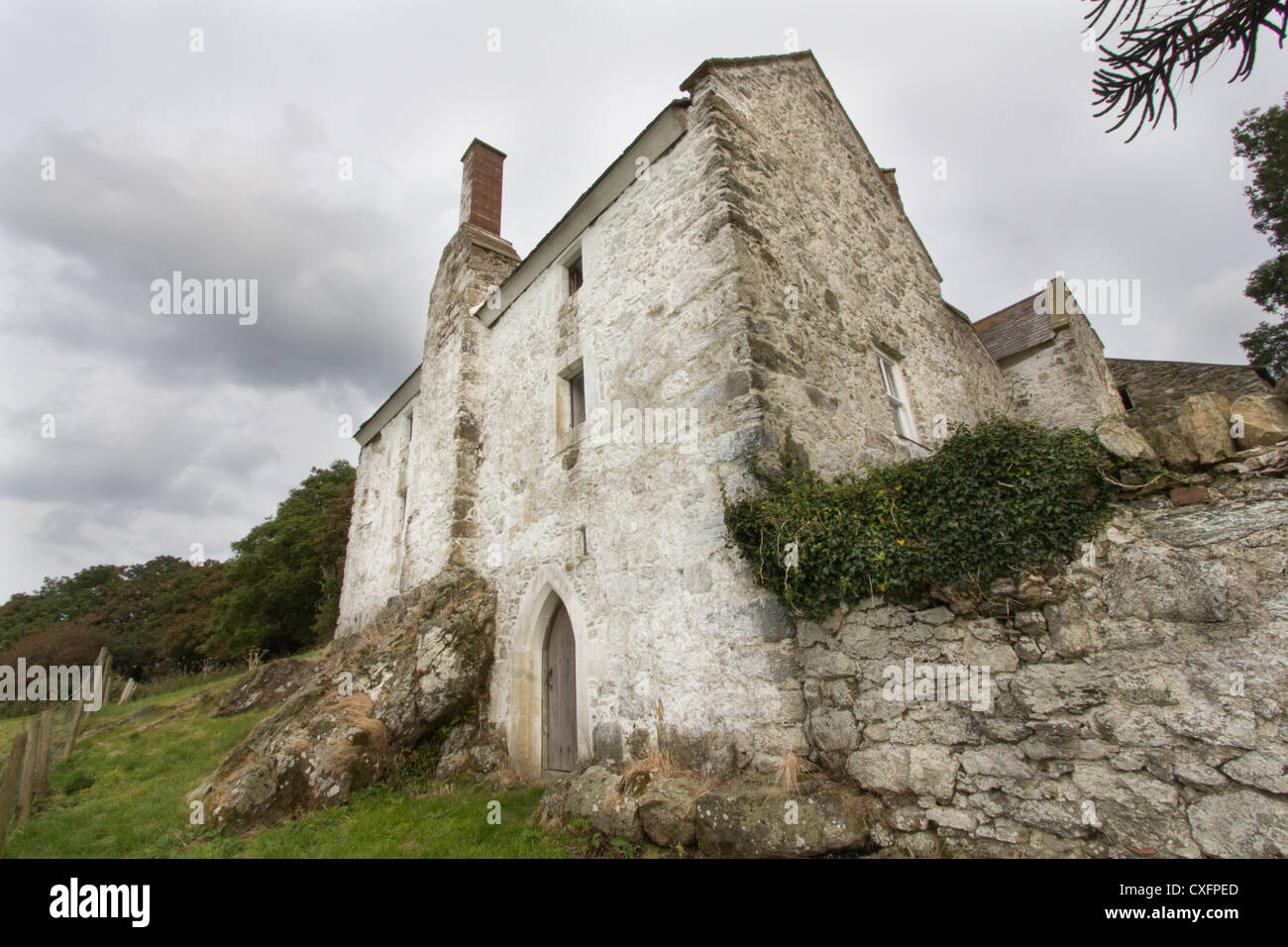 Medieval Welsh hall house, Neuadd Hafoty, Isle of Anglesey looked after by CADW, and open to the public on rare occasions. Stock Photo