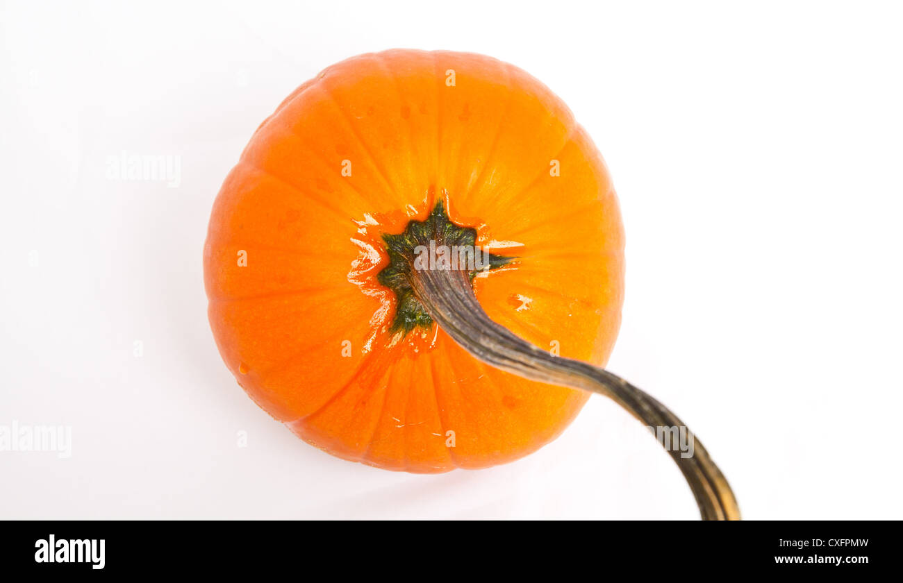The top of an orange pumpkin isolated on a white background. Stock Photo