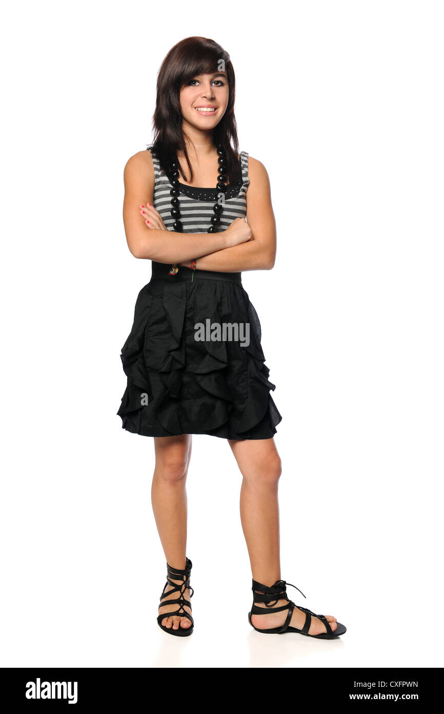 Hispanic teen with arms crossed over white background Stock Photo