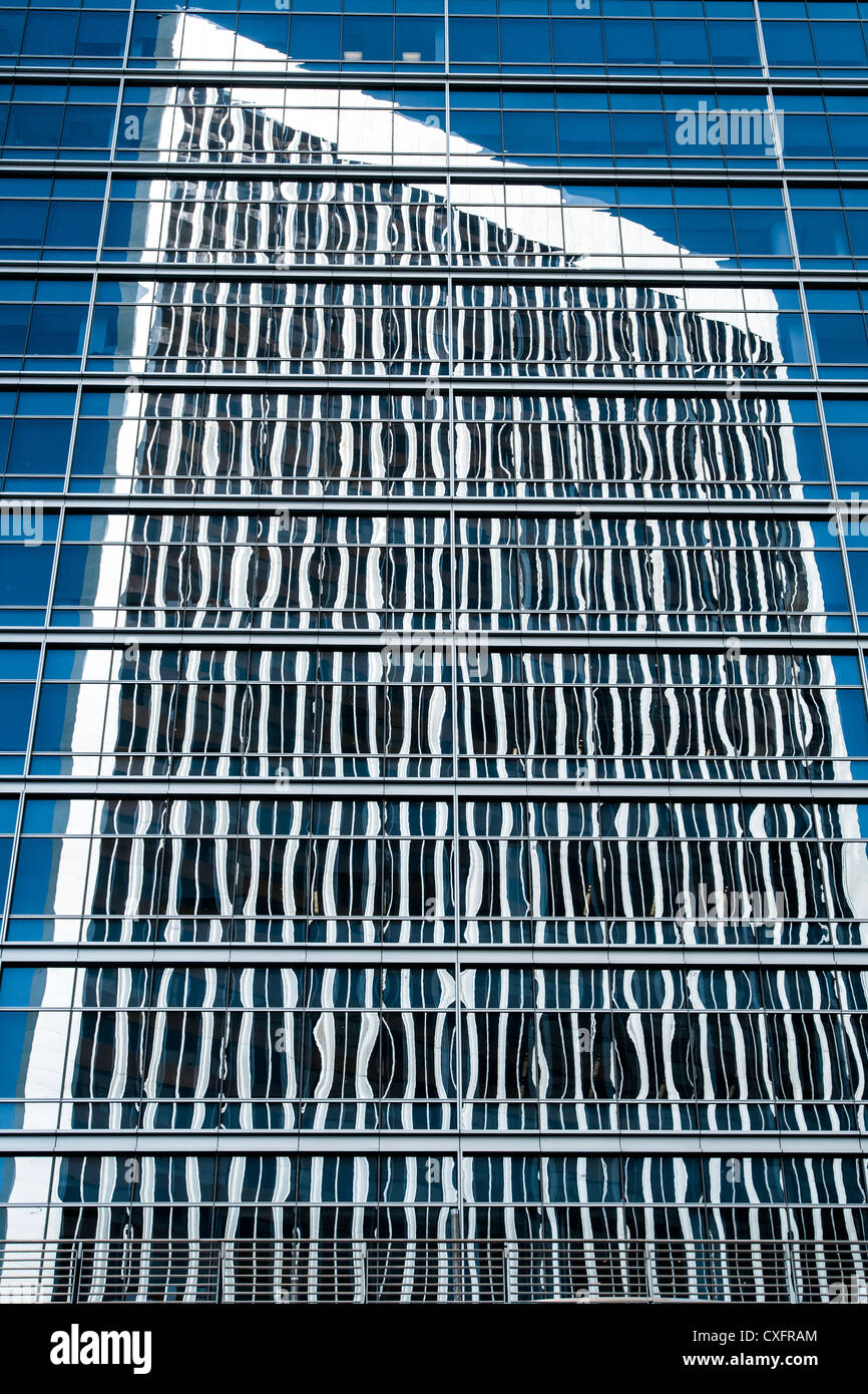 Tall buildings reflected in glass Stock Photo