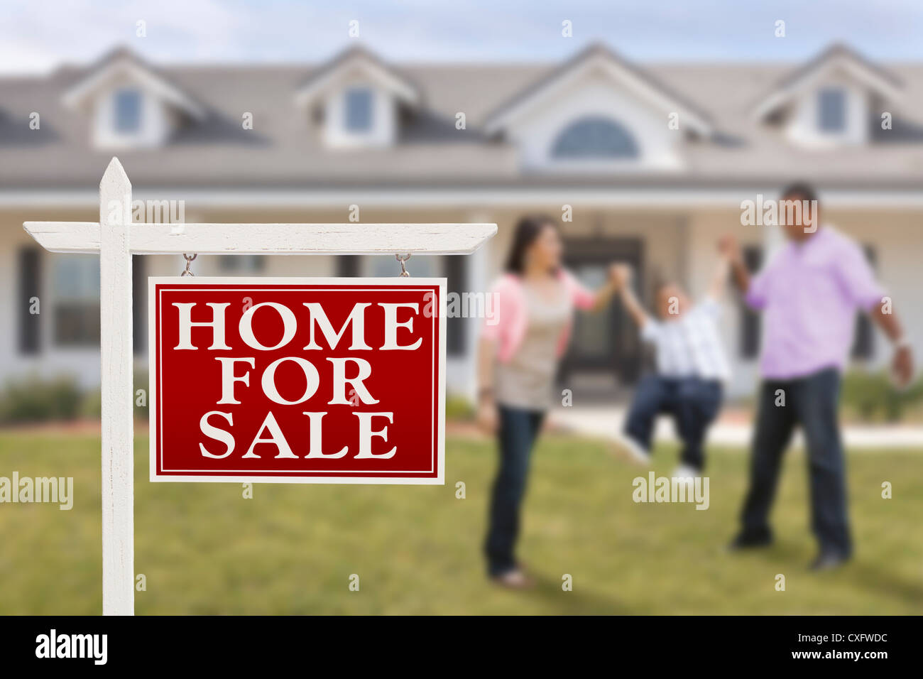 Home For Sale Real Estate Sign and Playful Hispanic Family in Front of ...