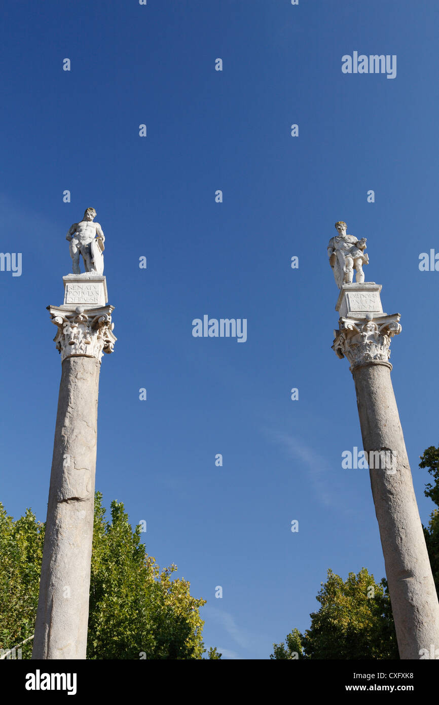 Roman columns topped with statues of Hercules and Julius Caesar at the Alameda de Hercules Seville Spain Stock Photo