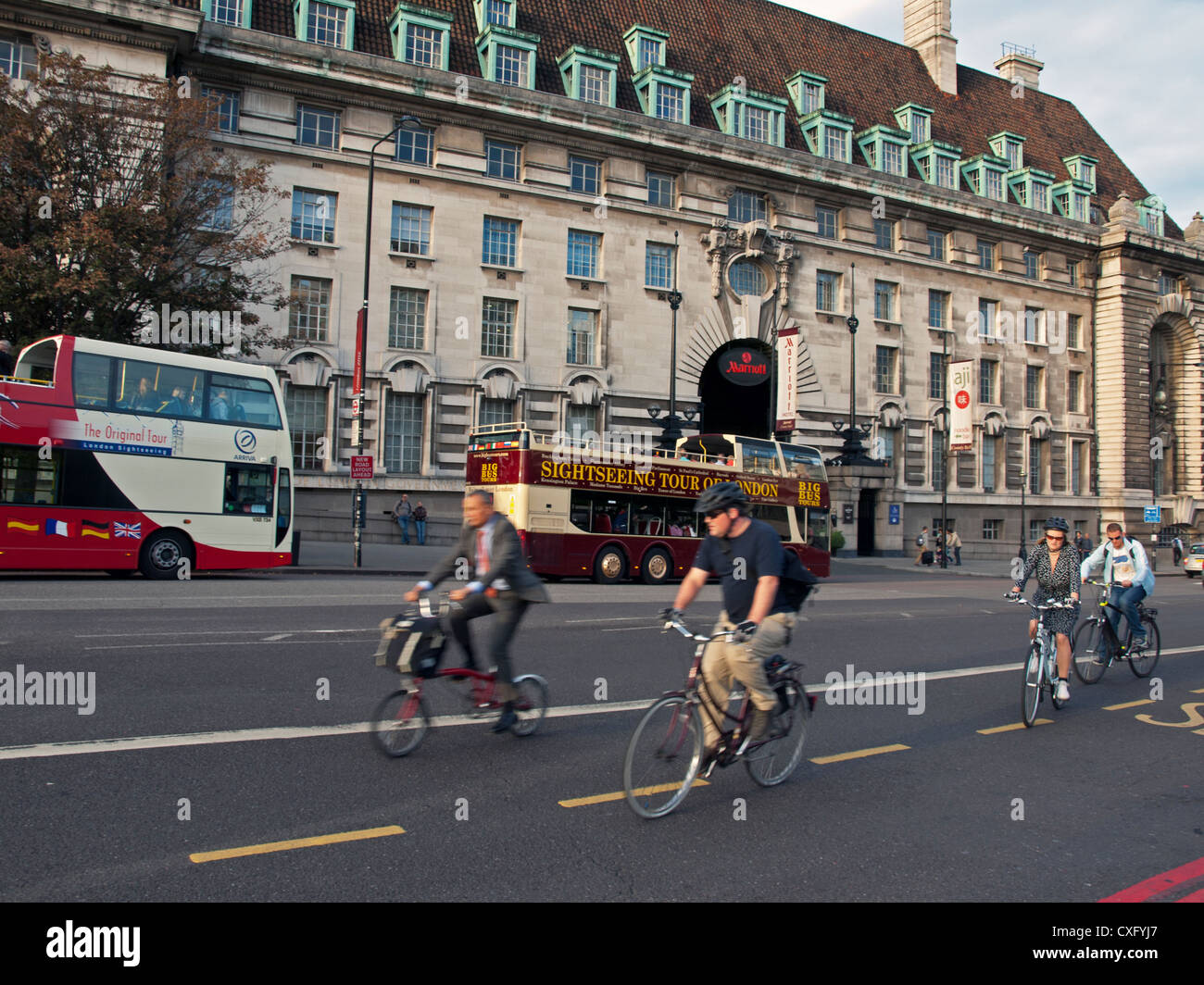 Cyclists on Westminster Bridge Road showing Marriot Hotel in background. Stock Photo