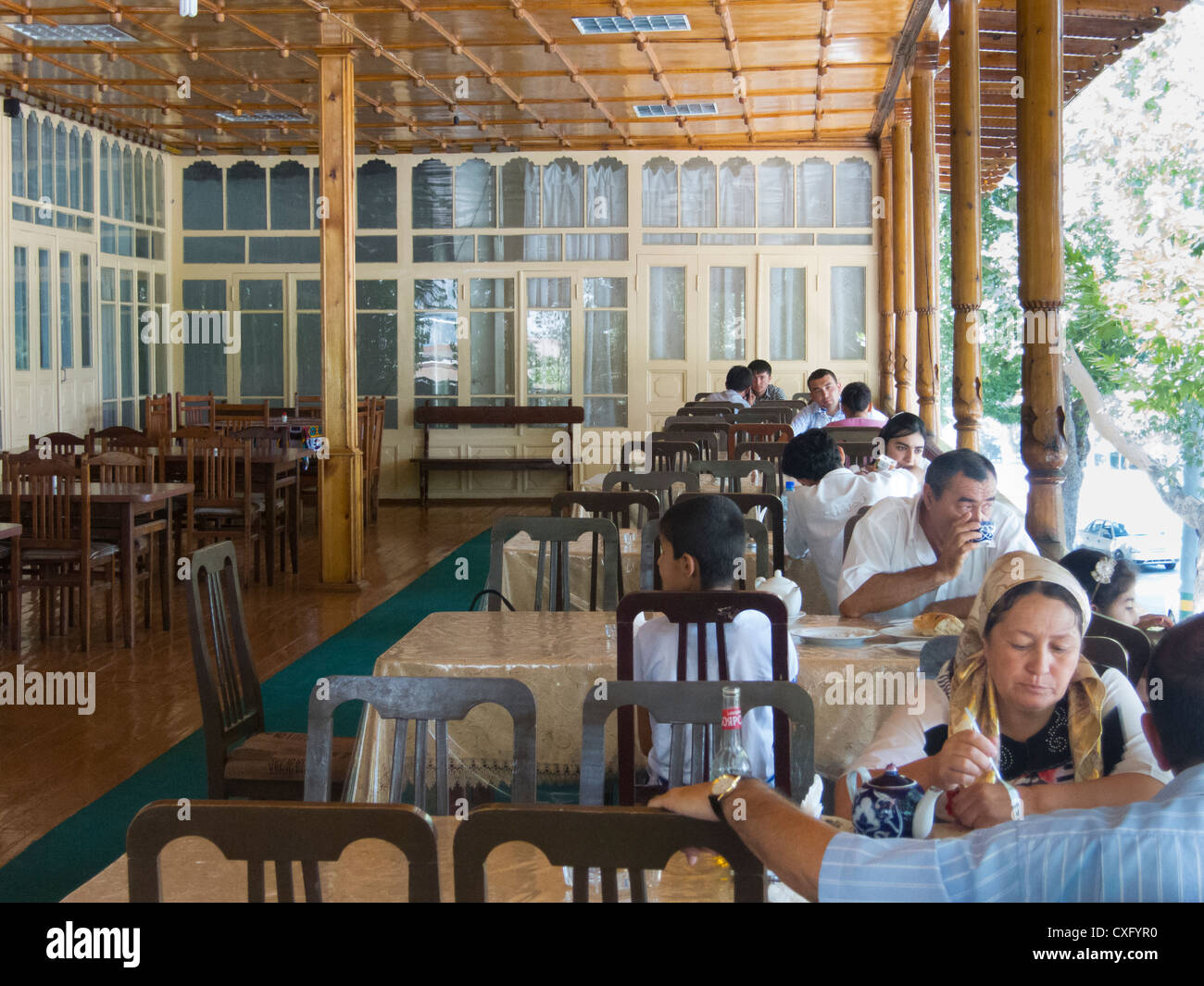 customers at a chaikhana (teahouse) in Samarkand, Uzbekistan Stock Photo