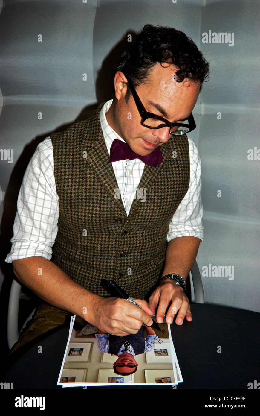 Interior designer Tommy Smythe signing autograph IDSwest trade show Vancouver BC Stock Photo