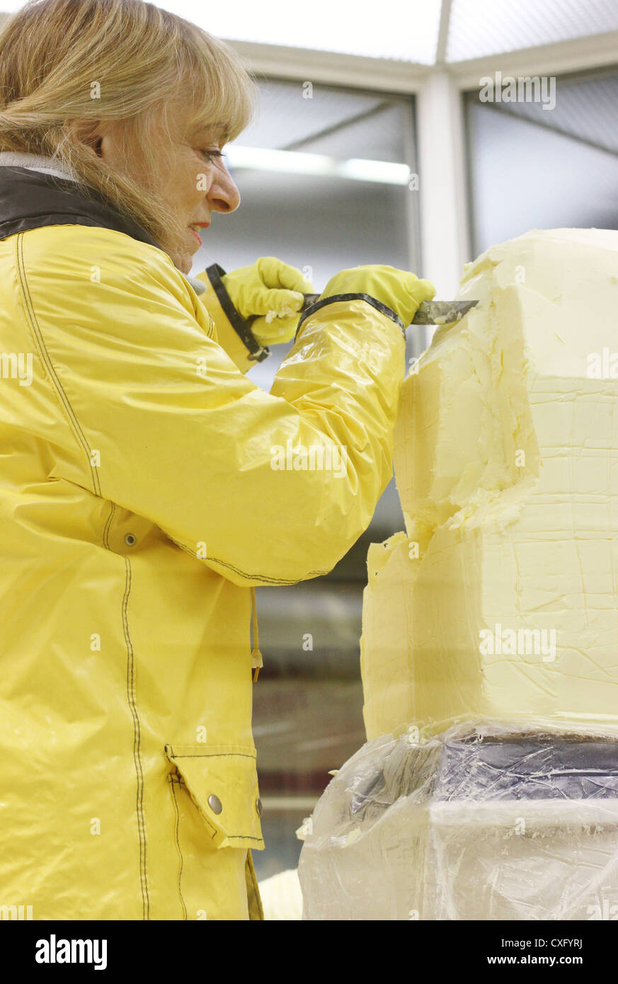 A butter sculptor at the Minnesota State Fair creating a sculpture of a