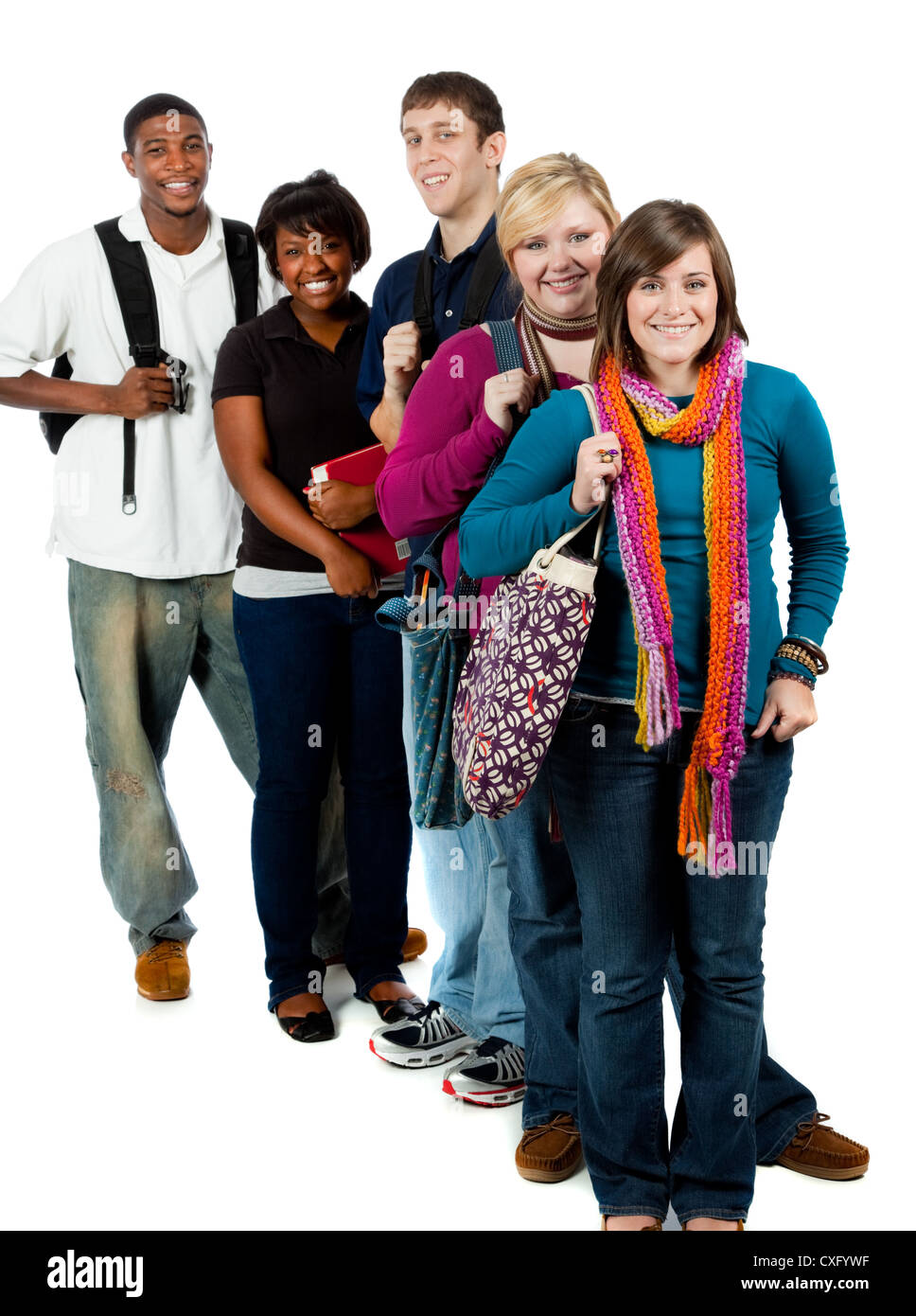 A group of happy multi-racial college students holding backpacks on a white background Stock Photo