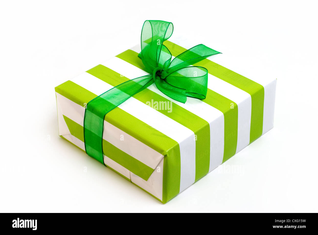 Green and white stripped gift paper with bow. Stock Photo