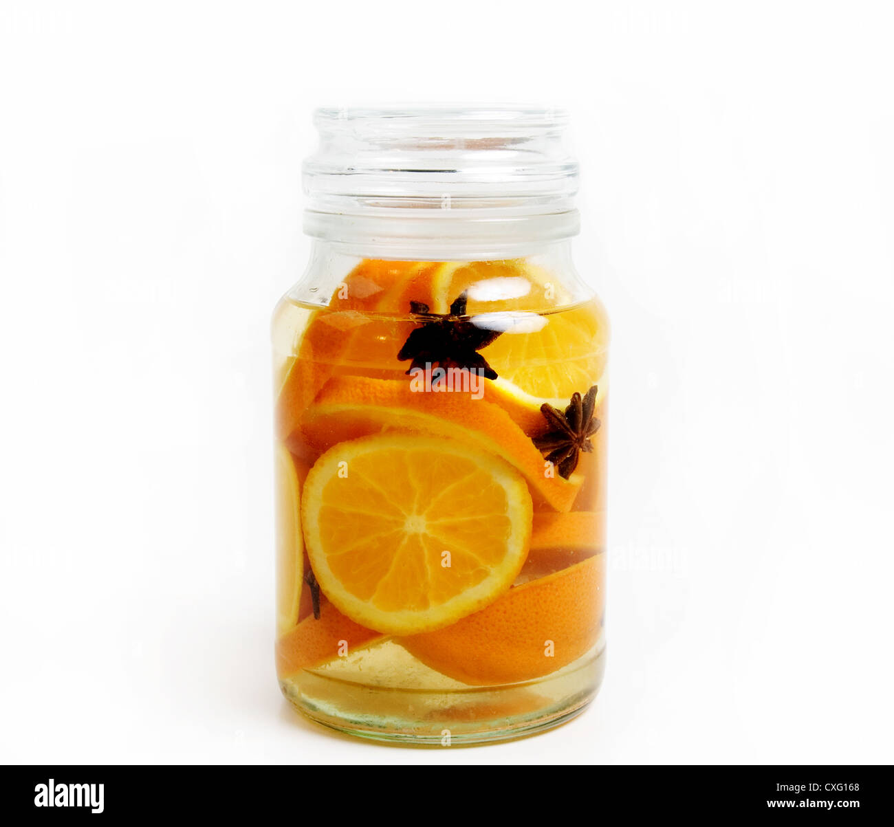 Orange slices with star anise in bottle. Stock Photo