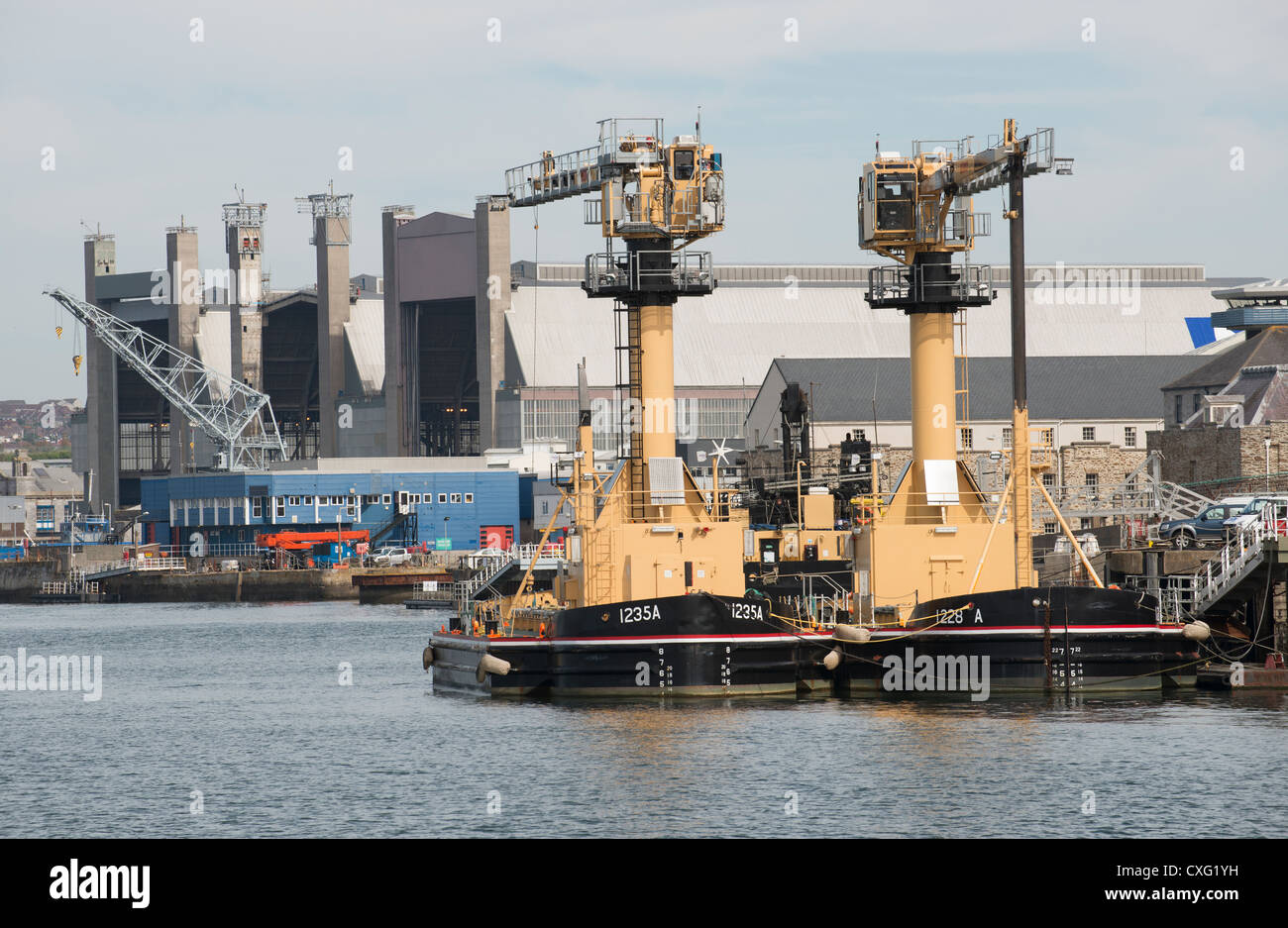 Ammunition loading barges Devonport Royal Dockyard Plymouth Devon UK Stock Photo