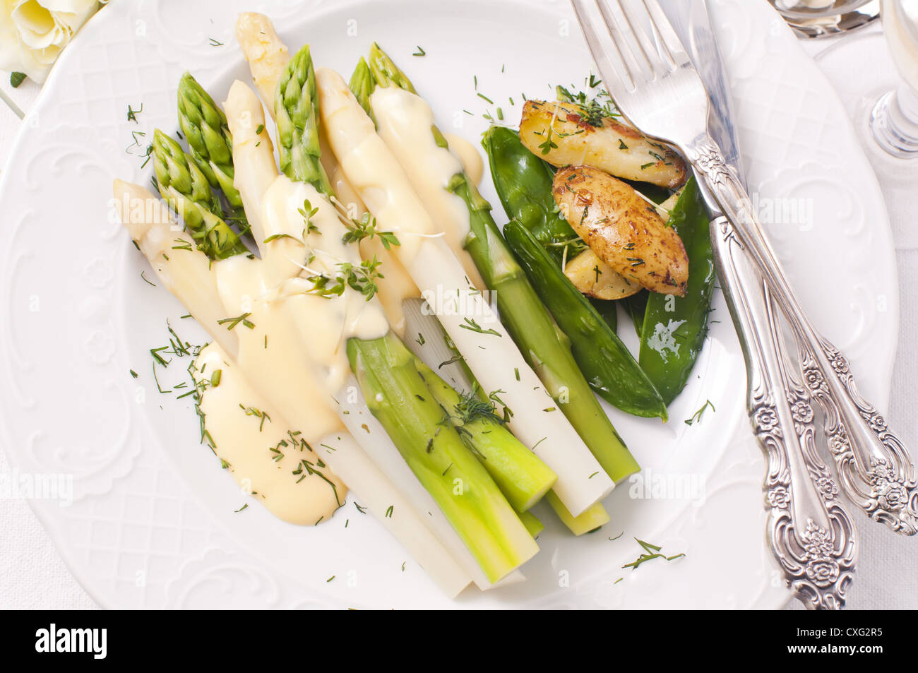 Asparagus with potato and sauce hollandaise Stock Photo