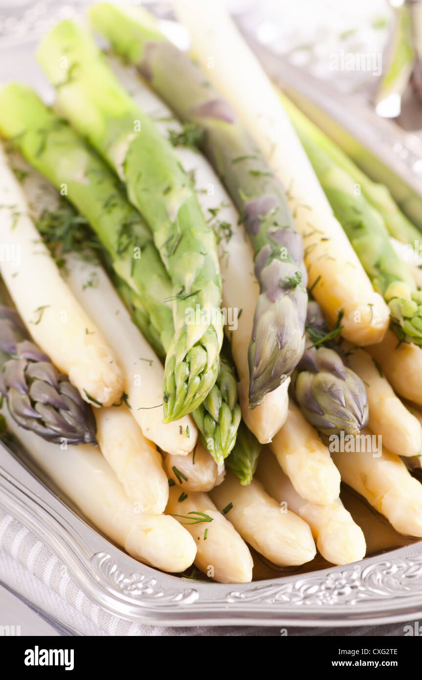 Asparagus green and white on silver tray Stock Photo