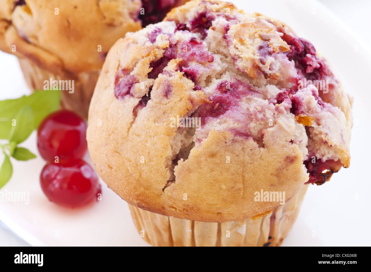 Raspberry muffin as closeup on white background Stock Photo