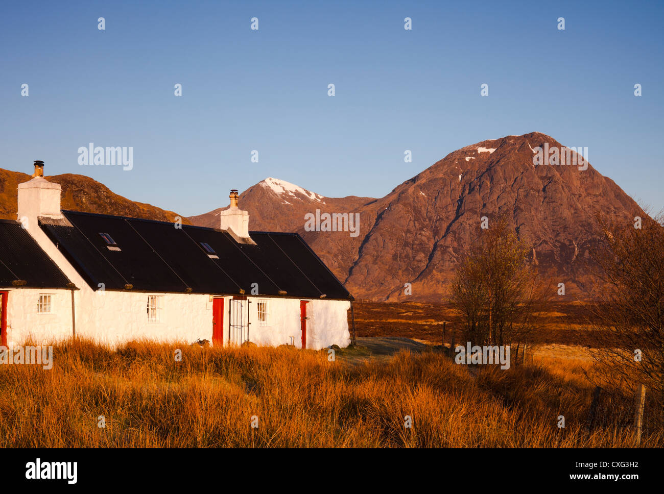 Black Rock Cottage, with Buachaille Etive Mor in background, Lochaber, Scotland, UK, Europe Stock Photo