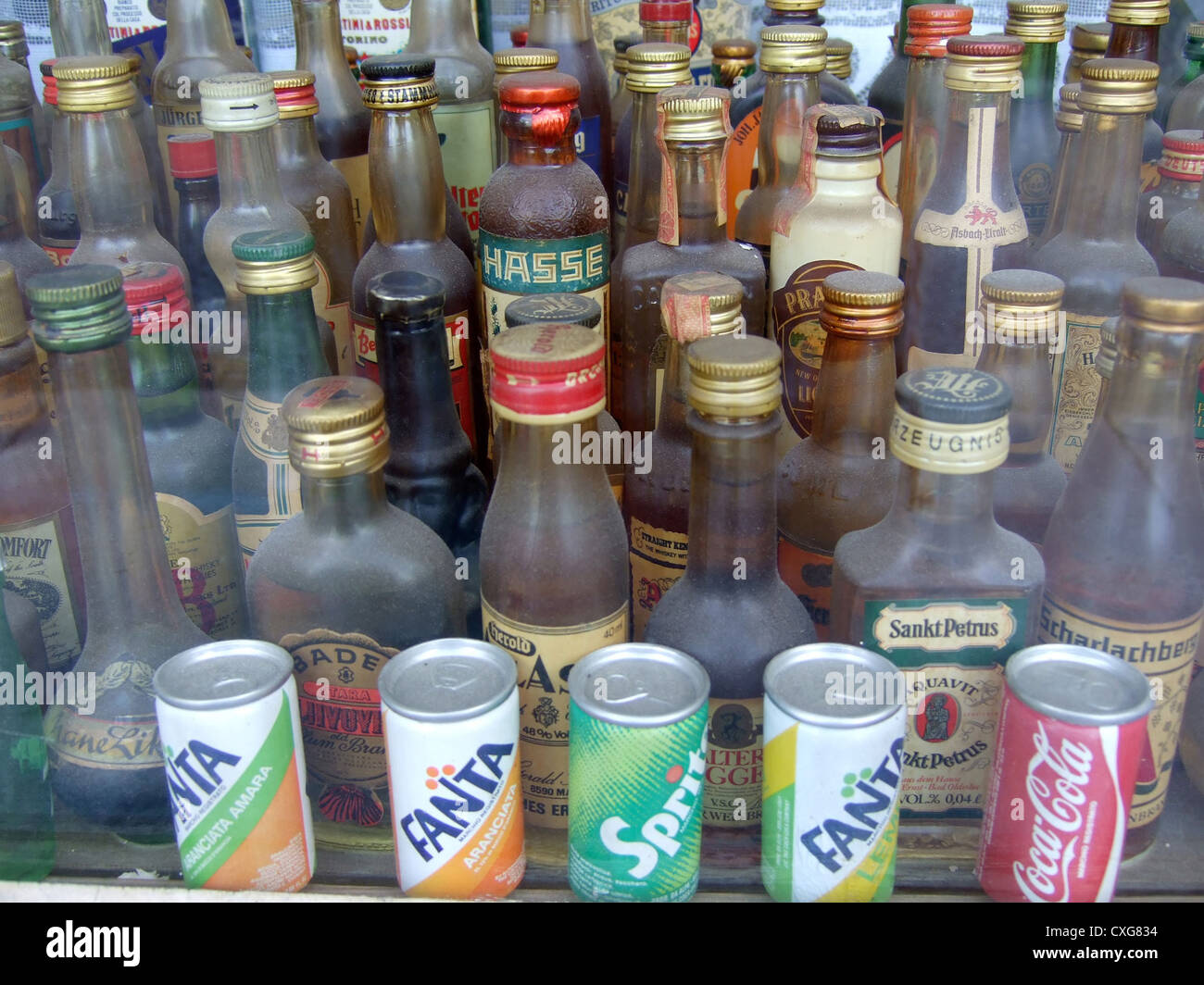 Berlin, dusty liquor bottles in a shop window Stock Photo