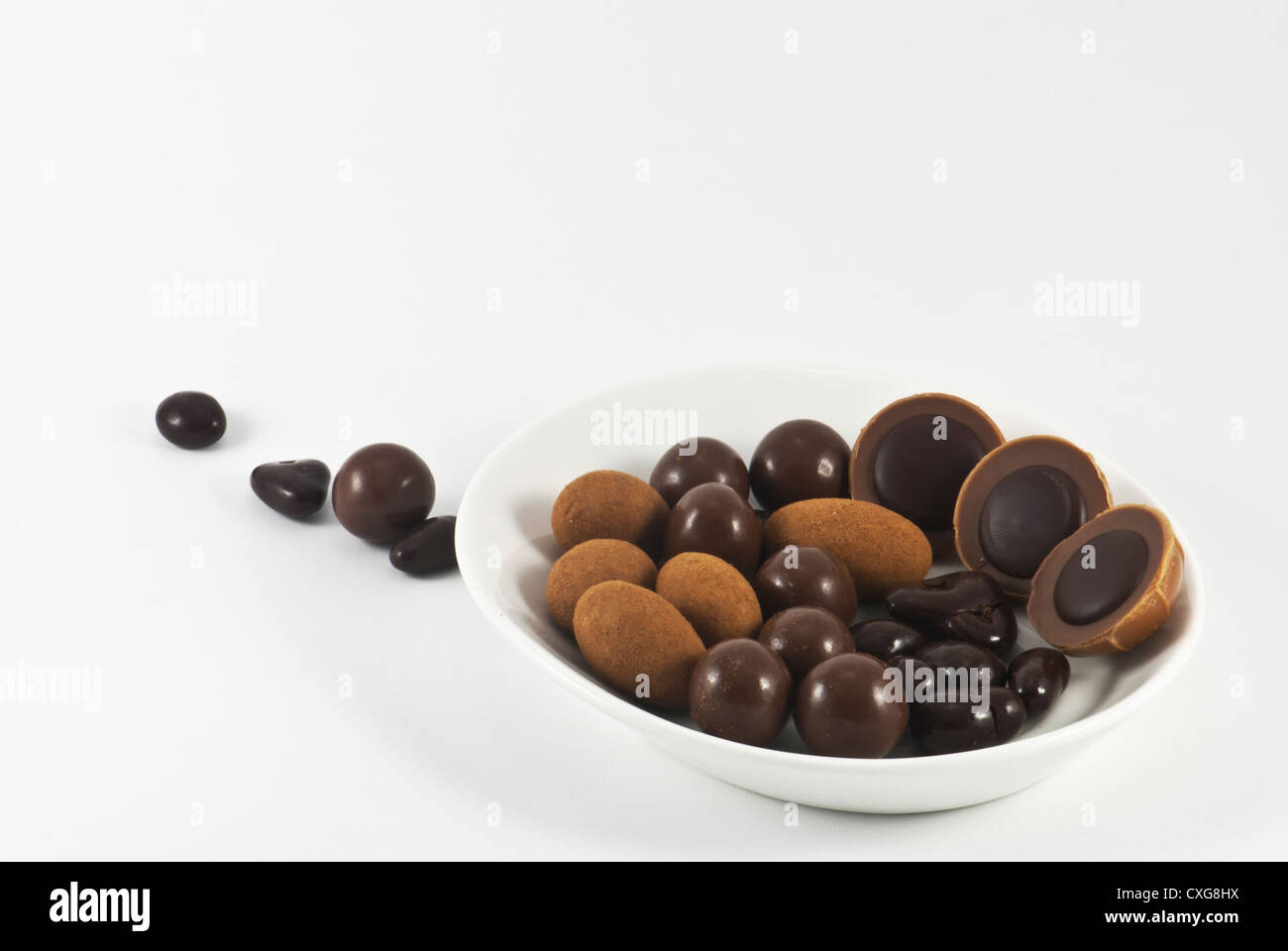 Chocolate bonbons on the white plate Stock Photo