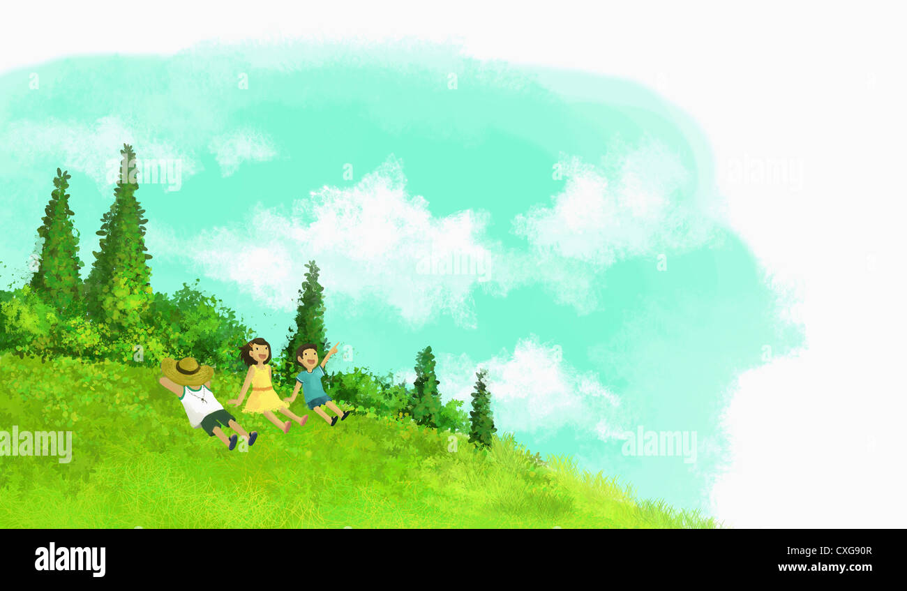 kids lying on the hill and looking up the sky Stock Photo