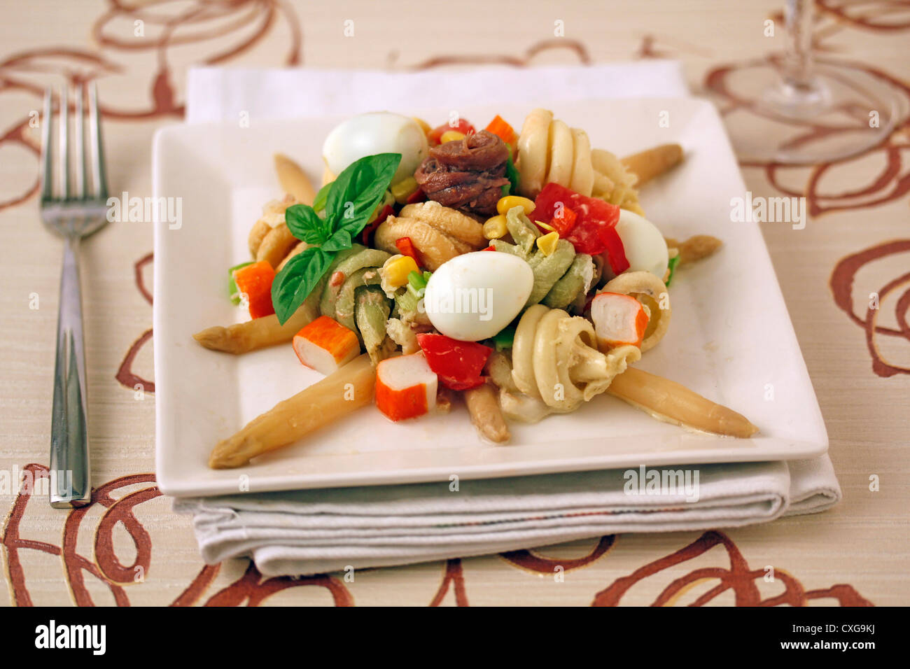 Pasta salad with surimi and eggs of quail. Recipe available. Stock Photo