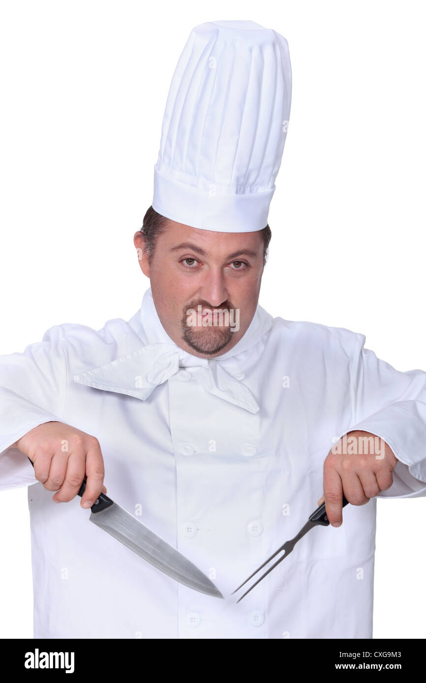 Chef with knife and fork Stock Photo Alamy
