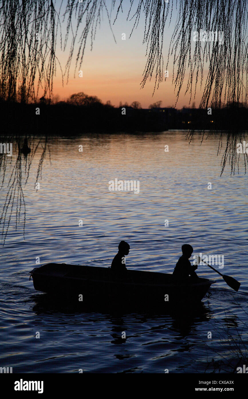 Potsdam, silhouettes of two guys in a boat in the evening sun Stock ...