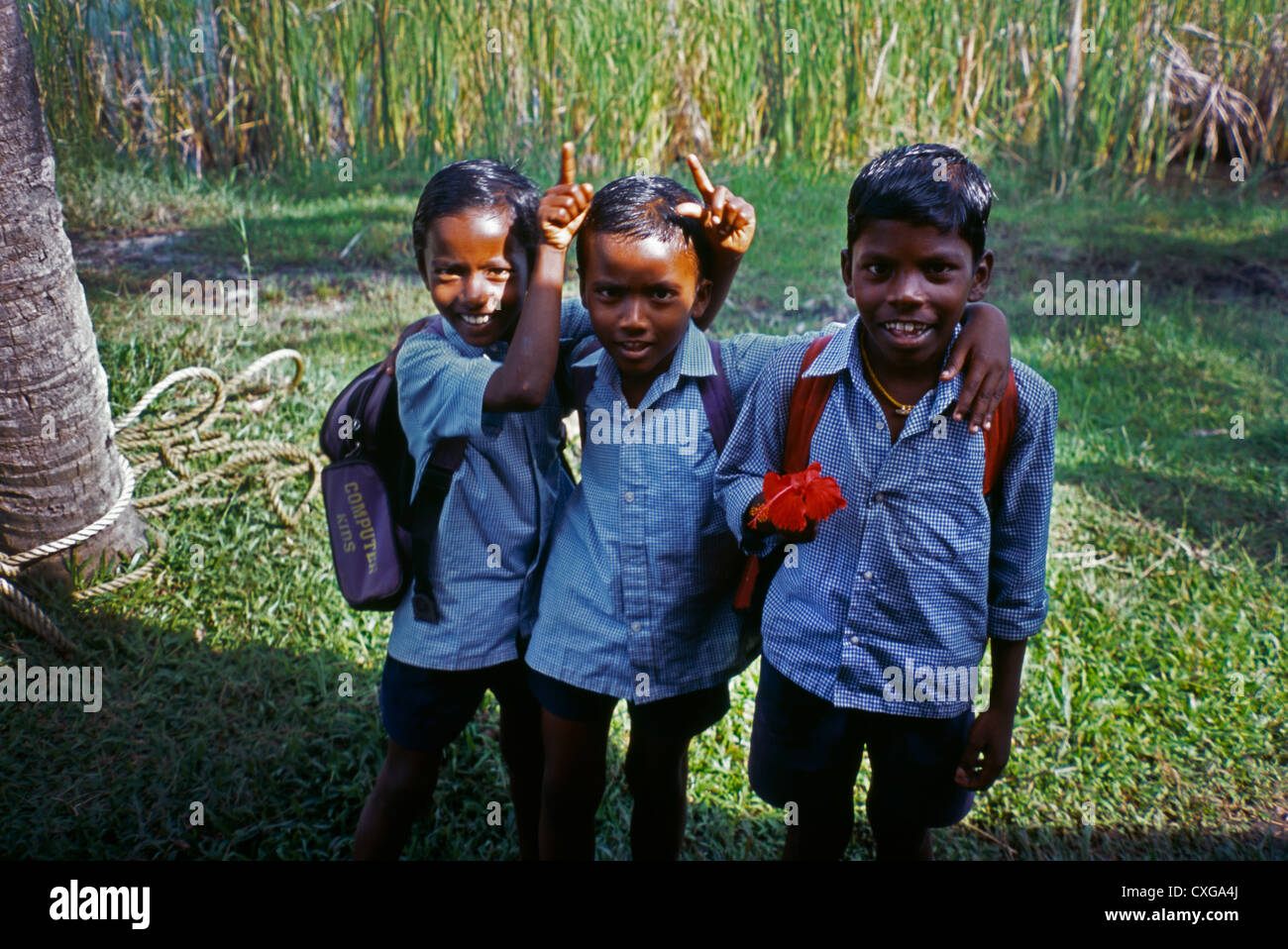 Kerala India Backwaters School Boys In Uniform One Boy Holding Flower Stock Photo