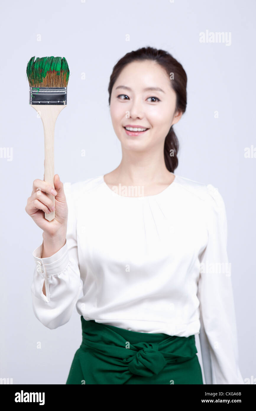 Woman paint brush hi-res stock photography and images - Alamy