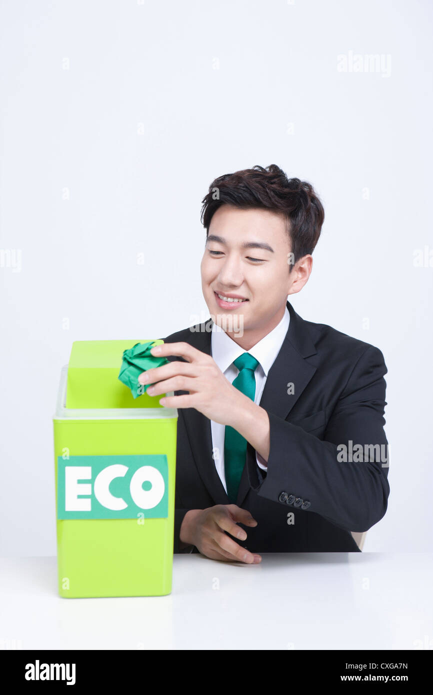 man throwing away trash into eco box Stock Photo Alamy